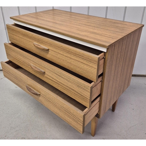 100 - A mid-century chest of three drawers, by 'Lebus'. Dimensions(cm) H68, W75, D43.