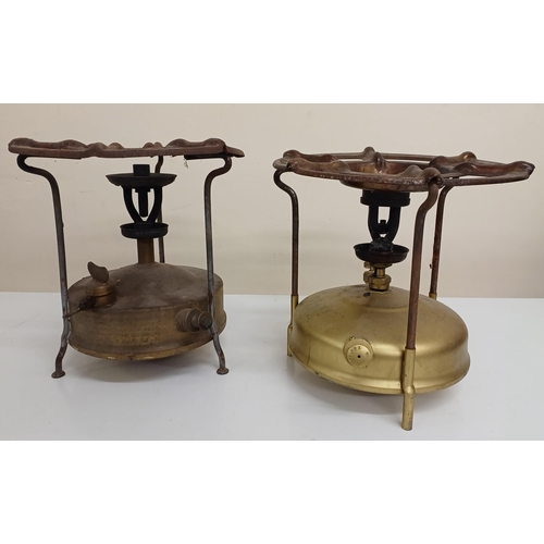 127 - Two vintage brass camping stoves, by 'Svea' (Sweden) & 'Coleman' (Canada). Heights 21cm & 23cm.