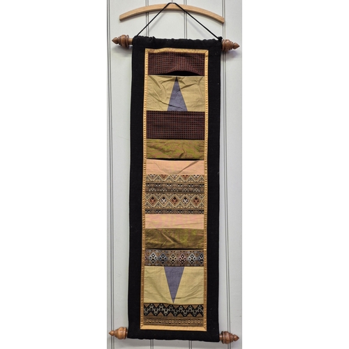 148 - A collection of oriental fabric, wall hanger, rug & shoe holder. Rug dimensions 156cm x 148cm.