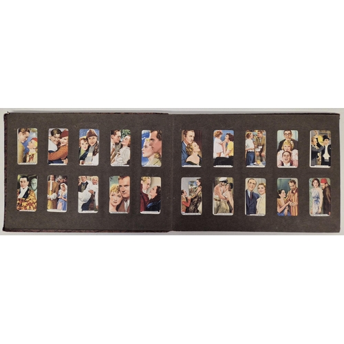 154 - A cigarette card album full of Gallaher Ltd & Godfrey Phillips Famous Faces/Scenes From Films sets.