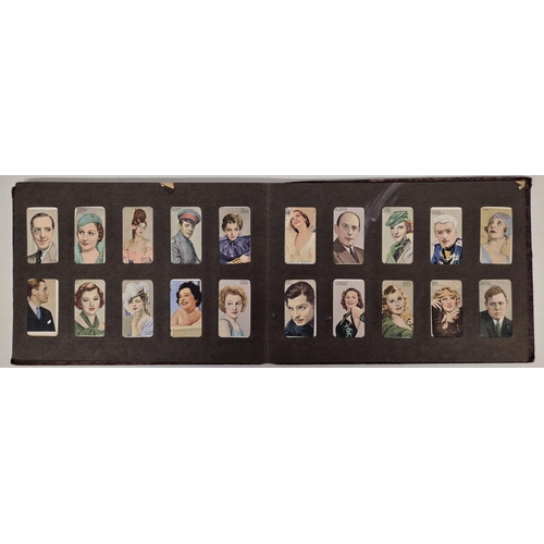 154 - A cigarette card album full of Gallaher Ltd & Godfrey Phillips Famous Faces/Scenes From Films sets.