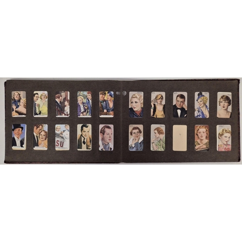 154 - A cigarette card album full of Gallaher Ltd & Godfrey Phillips Famous Faces/Scenes From Films sets.