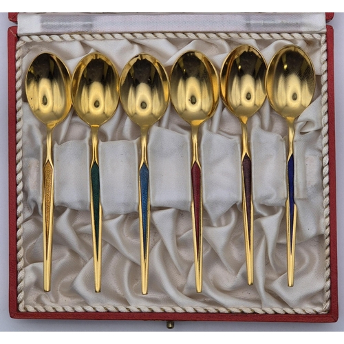 156 - A vintage set of hand enamelled spoons, by 'MEKA', with presentation box. Gold-toned, with six diffe... 