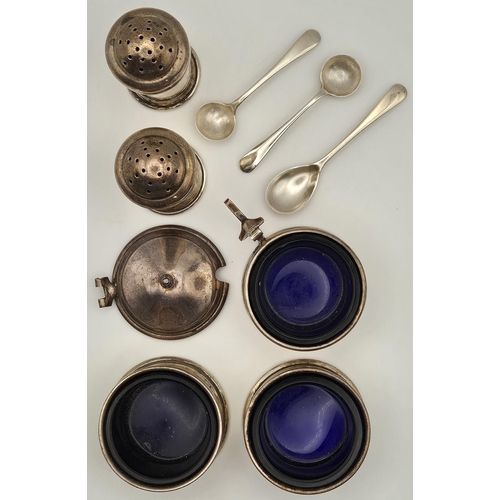 157 - A seven-piece set of vintage hallmarked silver tableware. To include three salts with blue glass lin... 