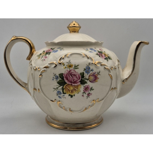 233 - A mid-century, Sadler Globe teapot, decorated with a pretty rose pattern. Dimensions(cm) H15.5, W23,... 