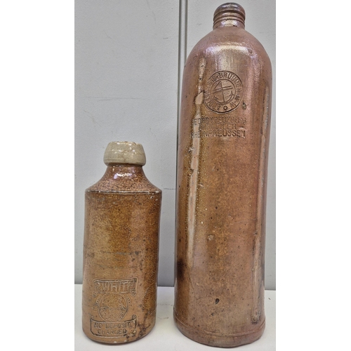 213 - Two antique salt glazed bottles. To include R Whites ginger beer bottle, together with a German wate... 