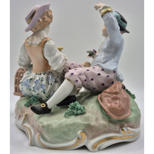 218 - An early 20th century Dresden figurine pair, relaxing with a lamb & bird. numbered 6993U. Dimensions... 