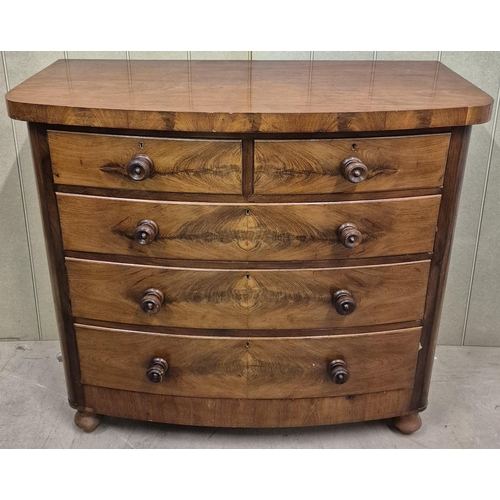 1 - A beautiful, bow-fronted, flame mahogany chest of two over three graduated drawers. No key present. ... 