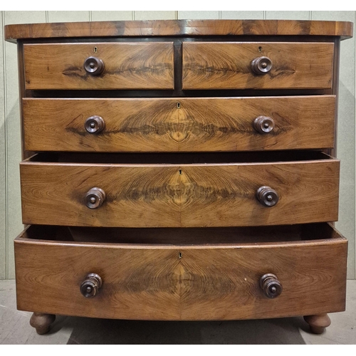 1 - A beautiful, bow-fronted, flame mahogany chest of two over three graduated drawers. No key present. ... 