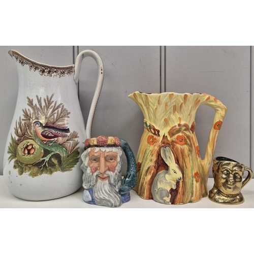 87 - A collection of 3 ceramic & 1 brass jugs. To include Burleigh Ware Art Deco Rabbit jug, Royal Doulto... 