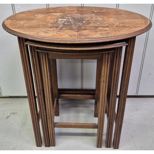 91 - A vintage nest of three tables. The larger being oval topped. Largest dimensions(cm) H57, W53, D35.