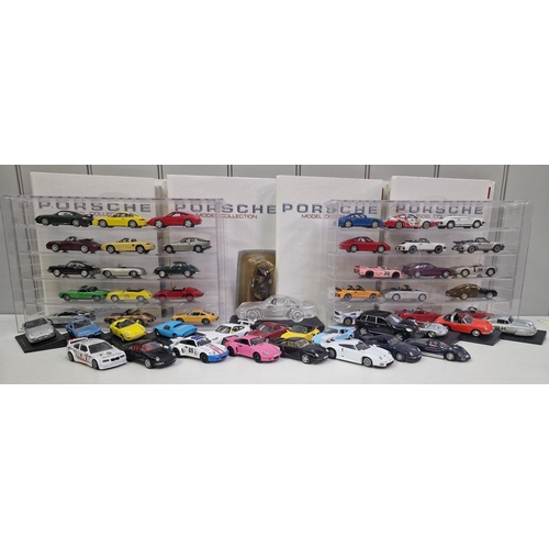 A collection (appears complete) of 52 DeAgostini Porsche models, with associated magazines (in binders) & plastic display shelves.