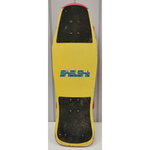 4262 - A colourful 1980's skateboard, by 'Skaight Board Stupid'. Length 77cm, width 26cm.