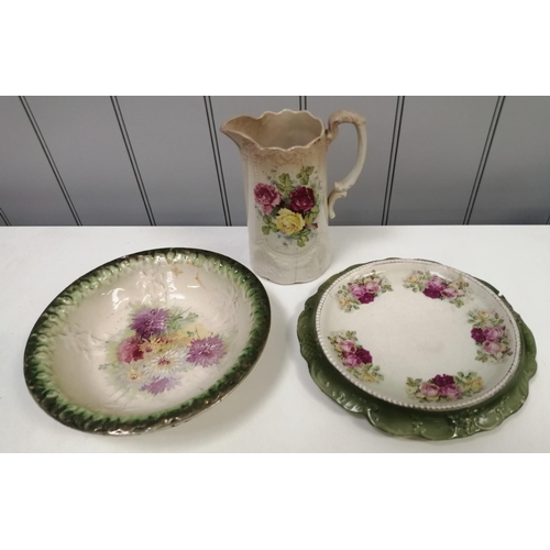 6388 - A collection of three ceramic tableware items. To include a bowl, serving dish & pitcher.