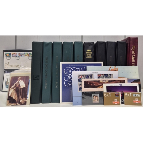 A large collection of first day covers. A total of 10 albums full of first day covers, along with 25 loose covers, stamp packs, postcard sets & postcards. . In total, approximately 775 first day covers.