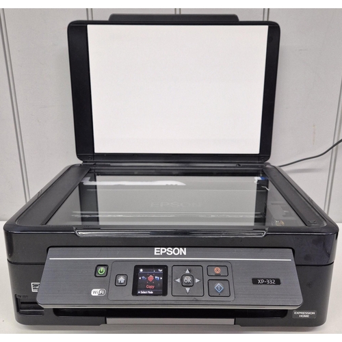 658 - An Epson Expression Home printer/copier/scanner, model no. XP-332; together with a quantity of photo... 