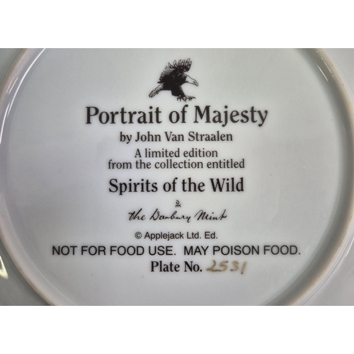 675 - A collection of 12 Danbury Mint wildlife-themed collector's display plates.