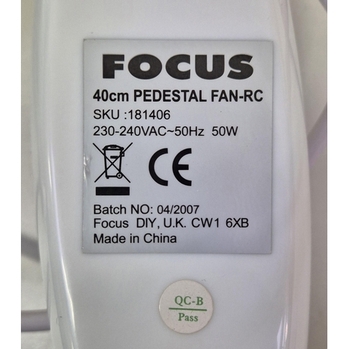 1462 - A boxed Focus pedestal fan, together with a Morrisons 1200W heater. PAT test passes & functionality ... 