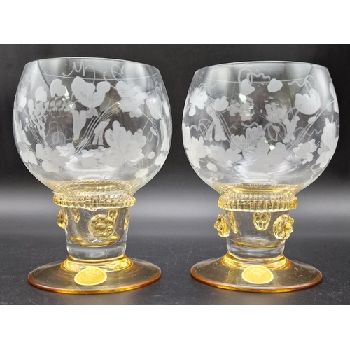 A stunning pair of 'Theresienthal' amber glass stemmed/etched clear glass body wine glasses, from the famous German maker. Height 10cm.