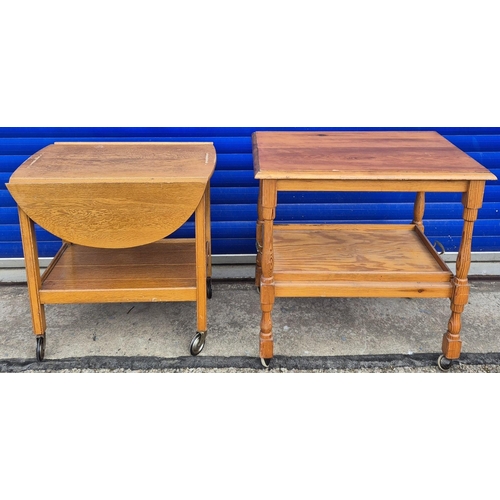 537 - Two tea trolley tables. To include a rectangular pine example with removable tray & another extendin... 
