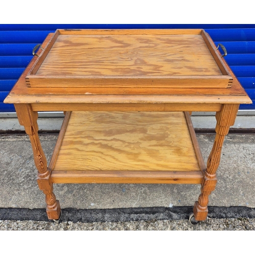 537 - Two tea trolley tables. To include a rectangular pine example with removable tray & another extendin... 