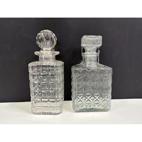 220 - Four vintage decanters & two water jugs.