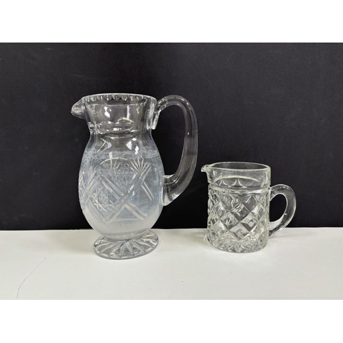 220 - Four vintage decanters & two water jugs.