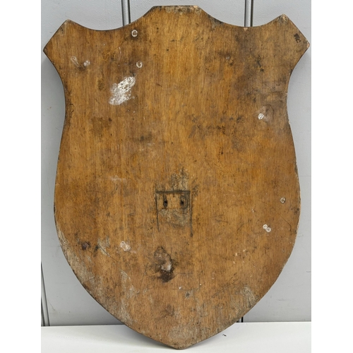 242 - Wooden shield bearing the coat of arms of Gloucestershire County Council. Dimensions(cm) H46, W33, D... 