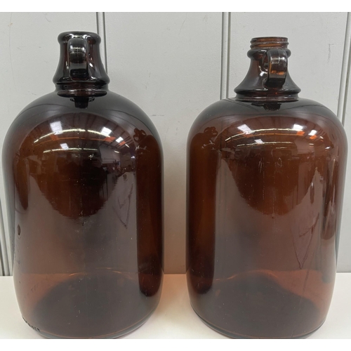 303 - Pair of vintage brown-glass demijohns.