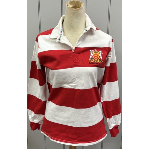 865 - Six Gloucester RFC shirts, together with a pair of Bristol City FC shin pads.