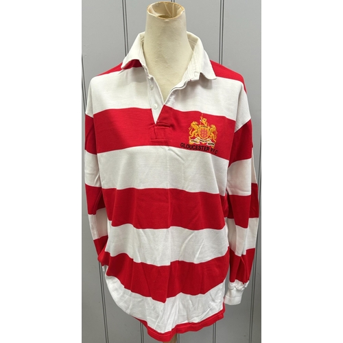 865 - Six Gloucester RFC shirts, together with a pair of Bristol City FC shin pads.