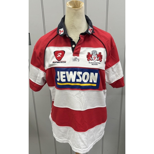 865 - Six Gloucester RFC shirts, together with a pair of Bristol City FC shin pads.