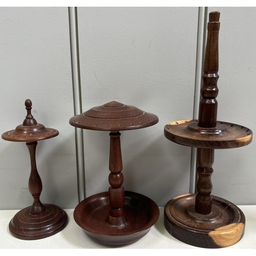875 - Collection of turned stands & shuttle. Majority being earring display stands.