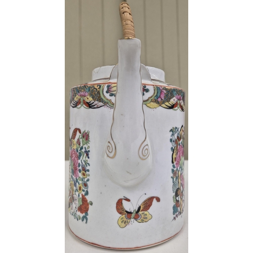 1037 - A vintage, vividly decorated, Chinese teapot. Height 26cm.
