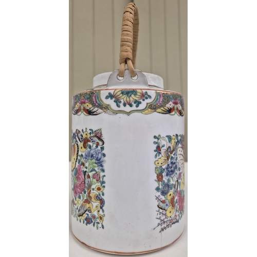 1037 - A vintage, vividly decorated, Chinese teapot. Height 26cm.