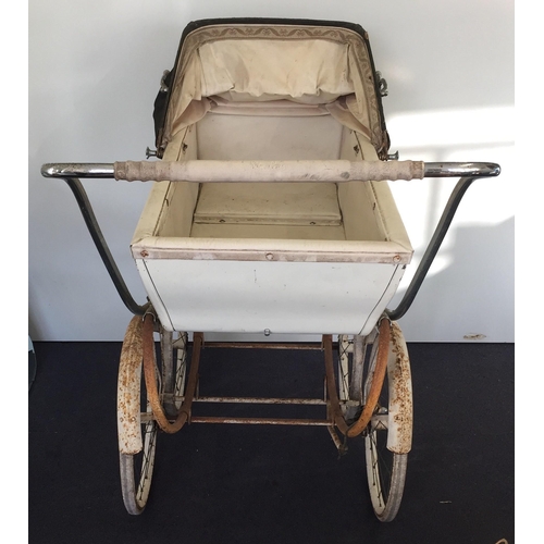 1136 - A vintage 'Silver Cross' coach-built pram, with green hood. Dimensions(cm) H96, L120, W63.