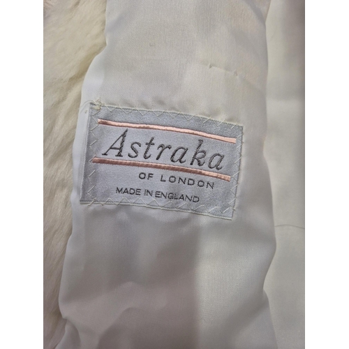 1166 - A vintage MAH black fur coat, together with an 'Astraka' faux fur white fur example (size 12).