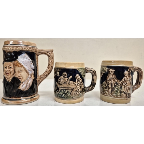 1198 - A vintage German, lidded stoneware punch bowl with two mugs, together with another larger similar st... 