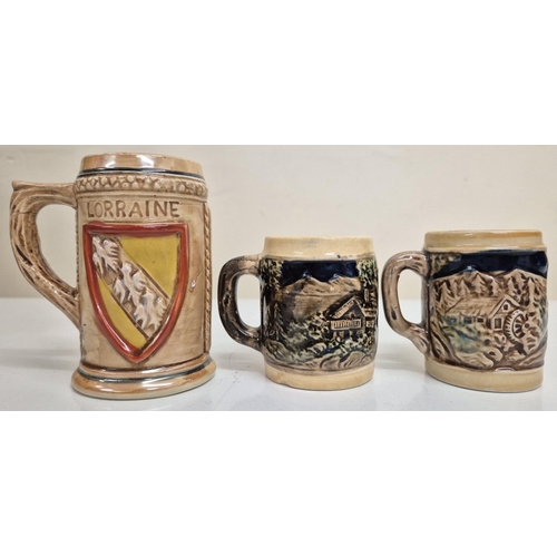 1198 - A vintage German, lidded stoneware punch bowl with two mugs, together with another larger similar st... 