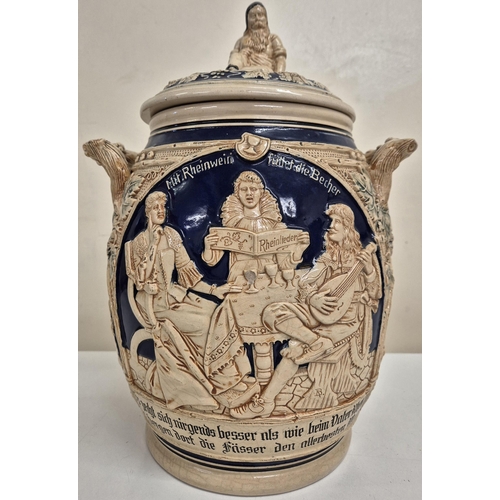 1198 - A vintage German, lidded stoneware punch bowl with two mugs, together with another larger similar st... 