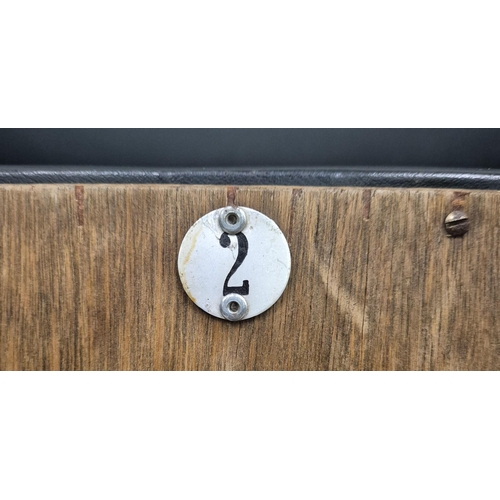 7025 - A bank of three original folding cinema seats, by 'PEL'. Tubular steel framed, with black leather se... 