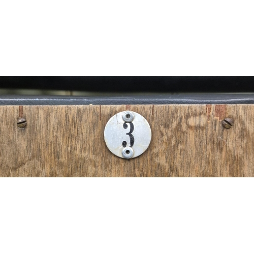 7025 - A bank of three original folding cinema seats, by 'PEL'. Tubular steel framed, with black leather se... 