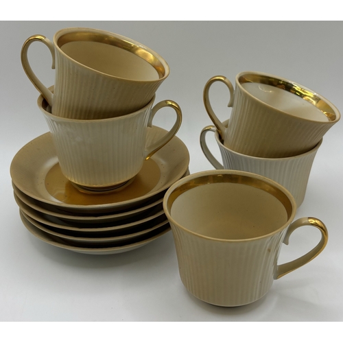 28 - Two coffee sets. To include 13-piece Ternopil (Ukrainian) & 15-piece Royal Doulton - Desert Star.