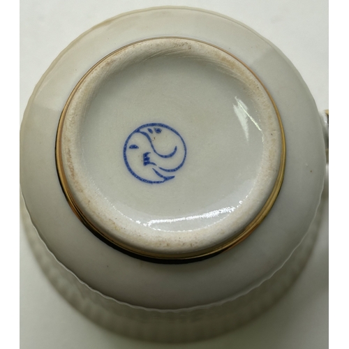 28 - Two coffee sets. To include 13-piece Ternopil (Ukrainian) & 15-piece Royal Doulton - Desert Star.