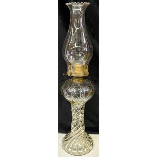 39 - Early 20th century patterned glass oil lamp. Height 43cm, diameter 11cm.
