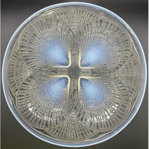 41 - Lalique Coquilles plate. Made of opalescent glass, the design features a geometric pattern on raised... 