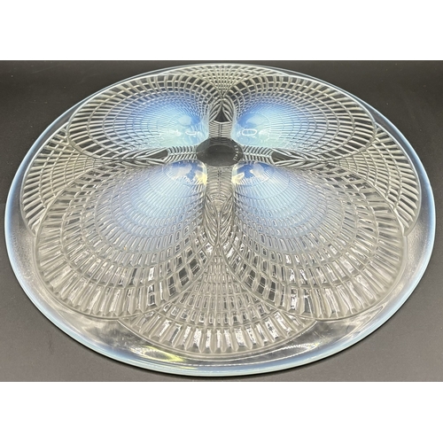 41 - Lalique Coquilles plate. Made of opalescent glass, the design features a geometric pattern on raised... 