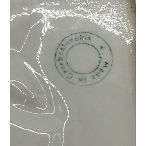 36 - Three Art-Deco style wall plates. Each depicting a lady & playing card suit. Made in the former Czec... 