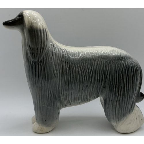 38 - Collection of 3 Lomonosov (Russian) dog figures. Tallest 16cm.