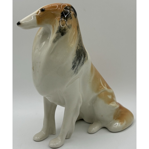 38 - Collection of 3 Lomonosov (Russian) dog figures. Tallest 16cm.